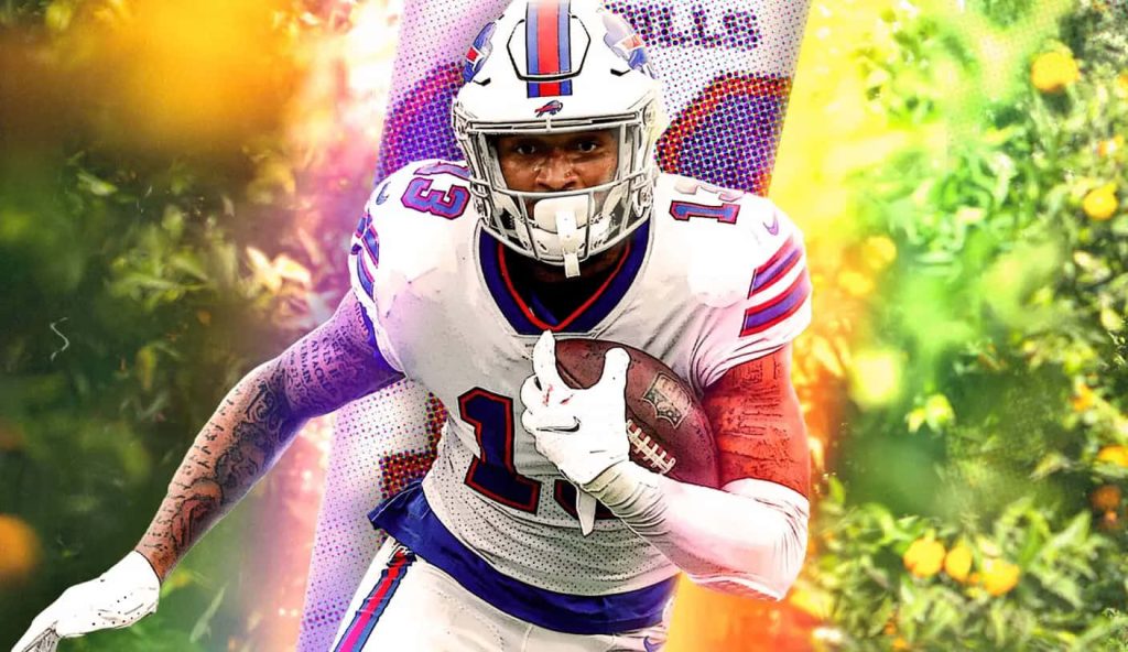 Buffalo Bills wide receiver Gabe Davis sprinting with football in white uniform dynamic wallpaper