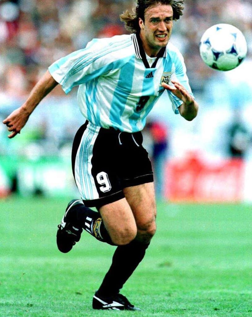 Gabriel Batistuta Argentina number 9 football action on green pitch intense soccer wallpaper