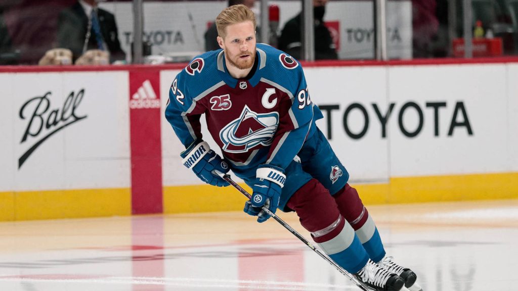 Gabriel Landeskog Colorado Avalanche captain in blue burgundy jersey skating on NHL ice rink wallpaper