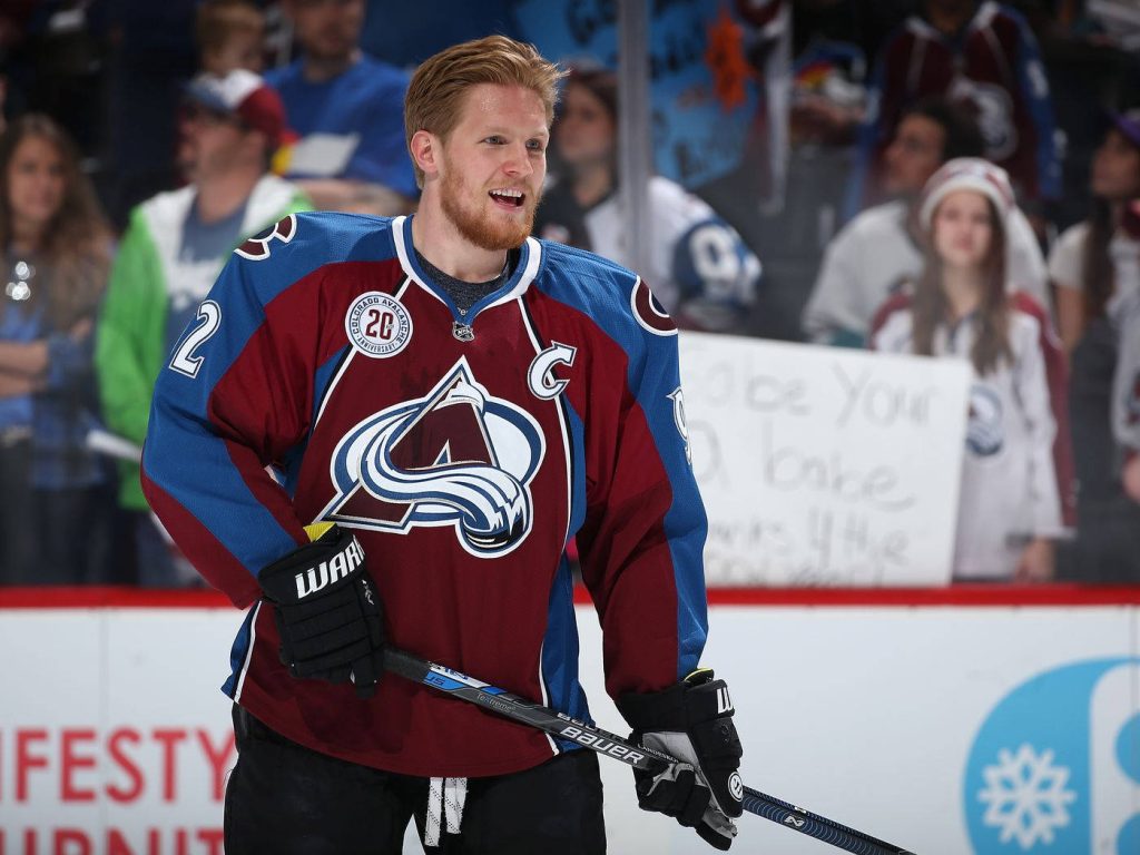 Gabriel Landeskog Colorado Avalanche NHL captain smiling on ice in maroon blue jersey wallpaper