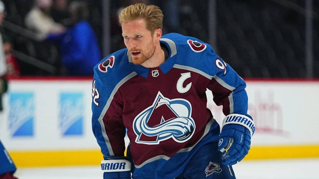 Gabriel Landeskog Colorado Avalanche captain in burgundy NHL jersey intense sports wallpaper