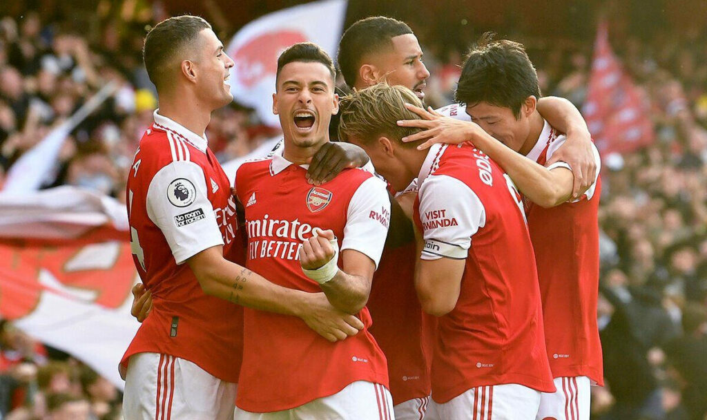 Gabriel Martinelli celebrating Arsenal goal with teammates vibrant football teamwork wallpaper