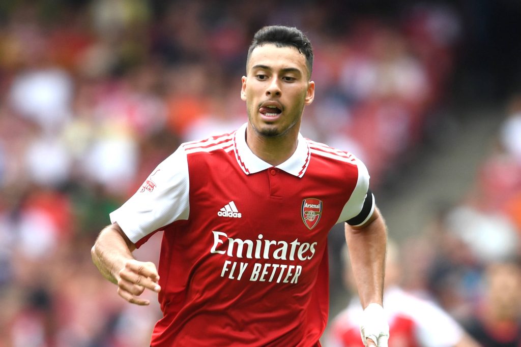 Gabriel Martinelli Arsenal forward sprinting in red and white kit dynamic match action wallpaper