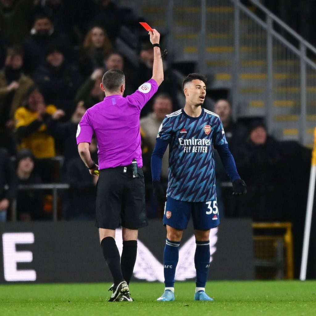 Arsenal Gabriel Martinelli receiving red card from referee intense football match action wallpaper