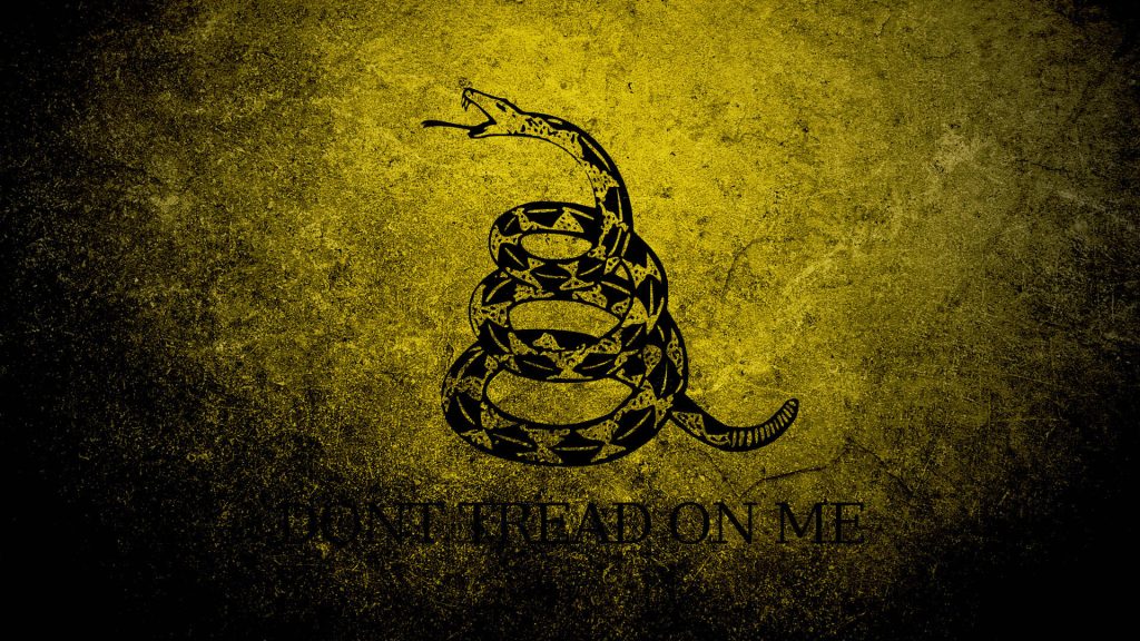 Gadsden Flag wallpaper with coiled rattlesnake textured yellow background and Dont Tread On Me text