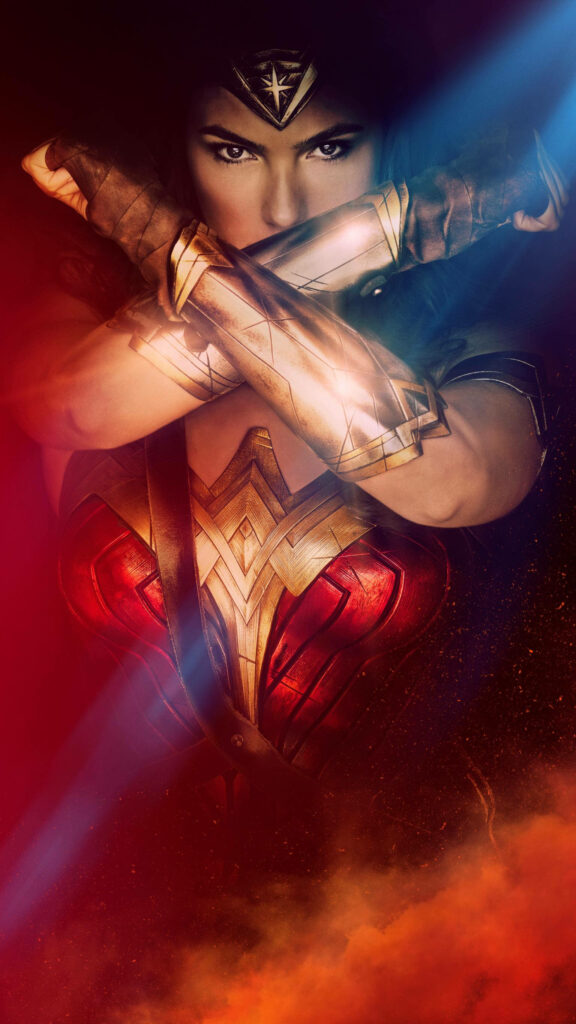 Gal Gadot as Wonder Woman striking crossed-bracelet pose emerging from red mist wallpaper