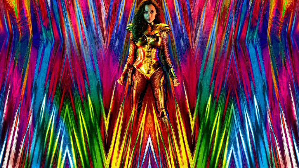 Gal Gadot as Wonder Woman in golden armor stands confidently vibrant multicolored abstract background Wallpaper