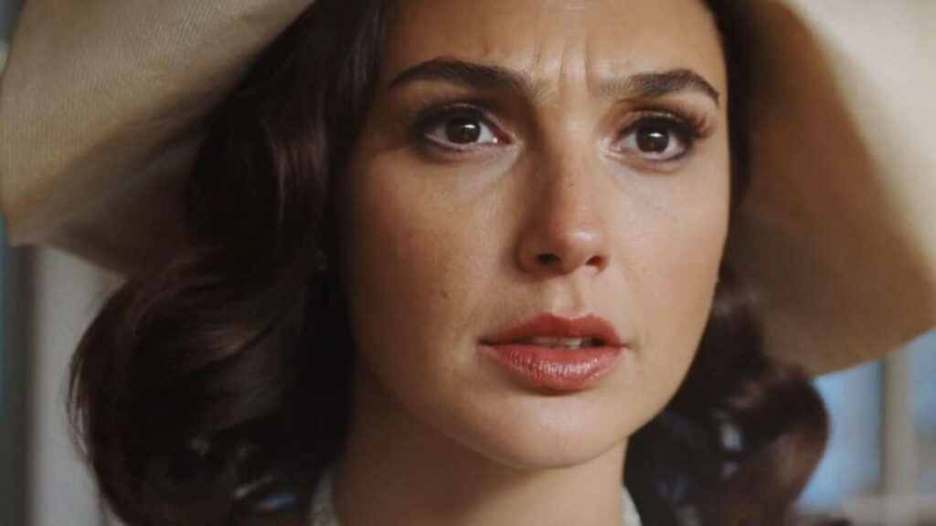 Gal Gadot as Linnet Ridgeway close up wearing elegant hat looking concerned in Death On The Nile Wallpaper