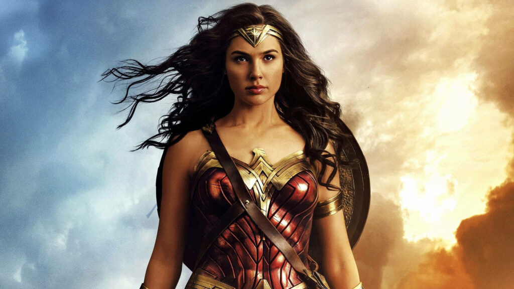 Gal Gadot as Wonder Woman in iconic armor with dramatic sky background wallpaper