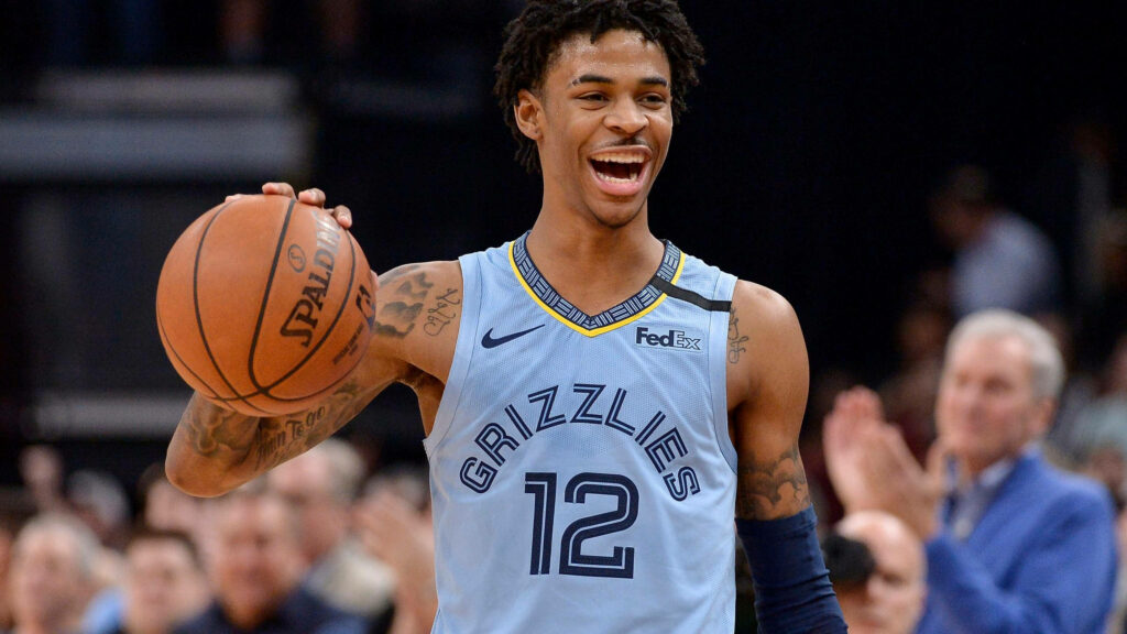 An Unforgettable Moment: Ja Morant Flaunts Skill and Joy on Court Wallpaper