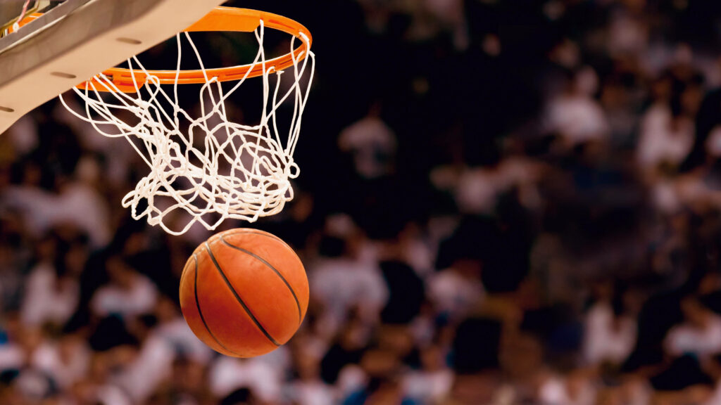 The Ultimate Hoops Journey: A High-Definition Basketball Encounter Amidst Enthusiastic Fans Wallpaper