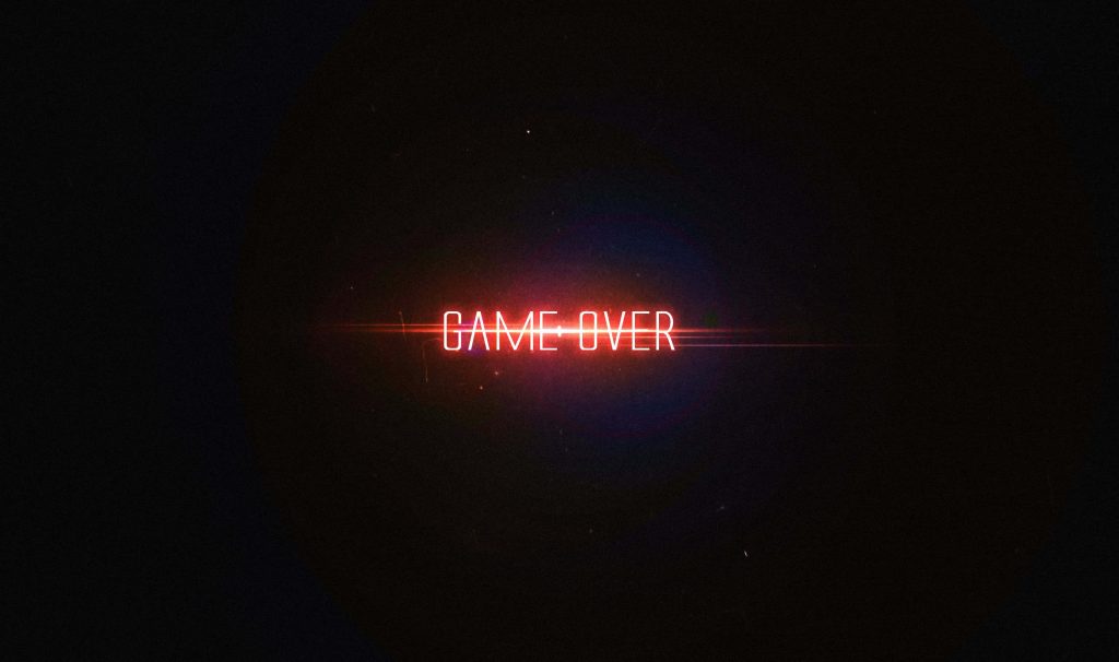 Minimalist Game Over wallpaper with glowing red text and cinematic lens flare on black background