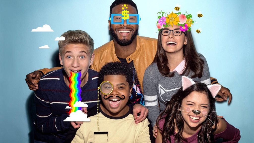 Game Shakers cast with fun digital filters on blue studio background playful wallpaper
