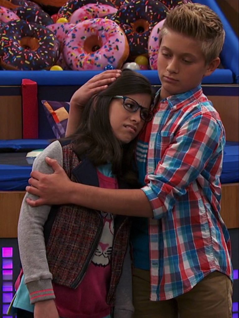 Hudson Gimble comforts Kenzie Bell in Game Shakers donut decor wallpaper background scene