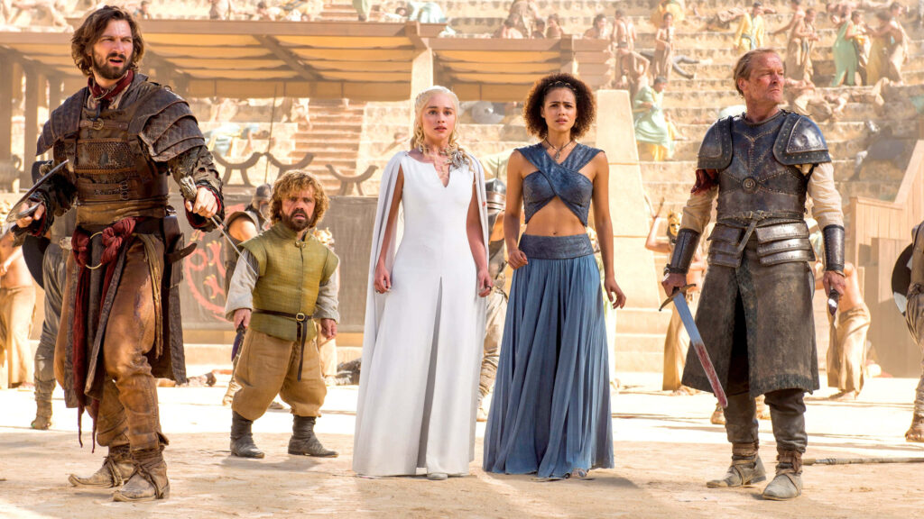 Epic Game of Thrones Wallpaper: Iconic Characters in Dramatic Setting