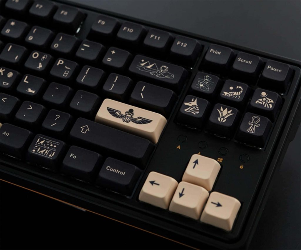 Gaming wallpaper with custom mechanical keyboard featuring beige accents and Egyptian symbols