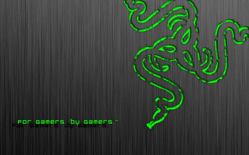 Sleek Silver Surface Showcasing Razer PC: The Ultimate Gaming Experience Wallpaper