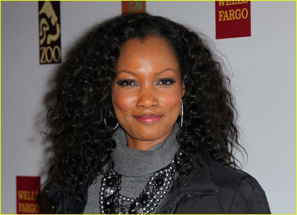 High-resolution portrait of Garcelle Beauvais in grey turtleneck and statement necklace at Wells Fargo event Wallpaper