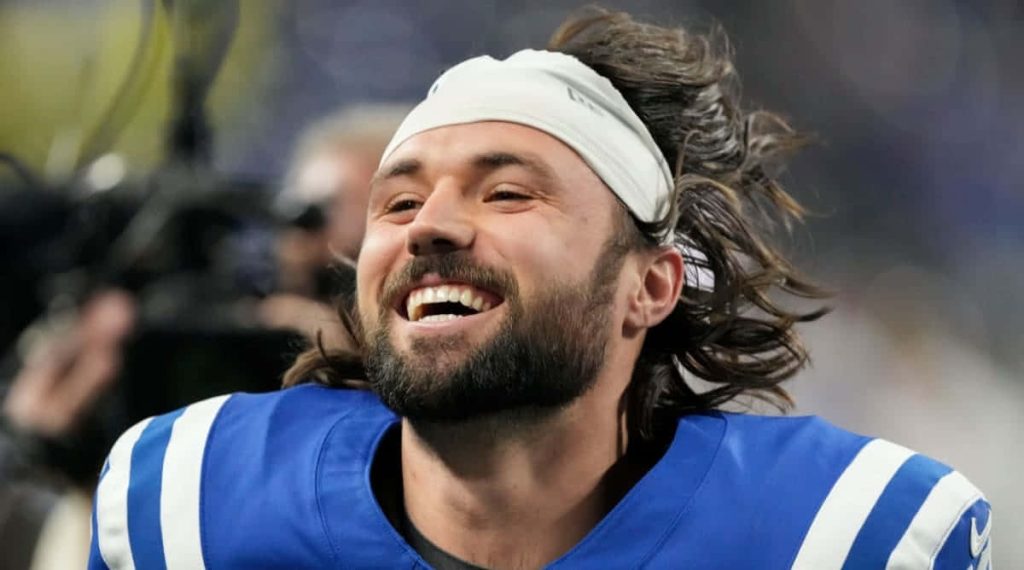 Gardner Minshew II smiling close-up in Indianapolis Colts blue jersey and white headband wallpaper