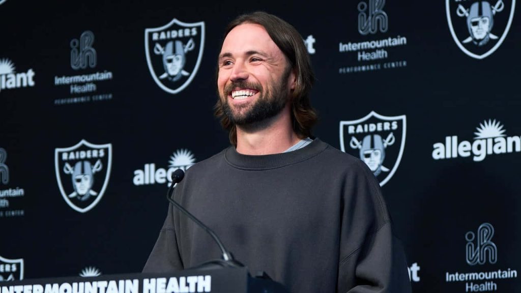 Gardner Minshew II smiling at press conference Las Vegas Raiders Intermountain Health background Wallpaper