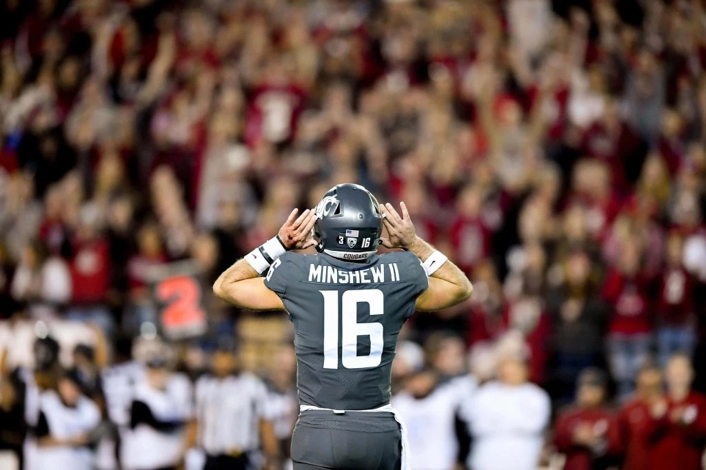 Washington State Cougars quarterback Gardner Minshew II in gray jersey during intense college football game Wallpaper