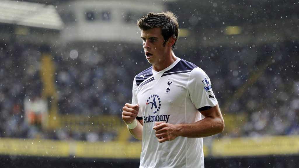 Gareth Bale in white Spurs kit action shot rainy stadium dramatic crowd Tottenham wallpaper