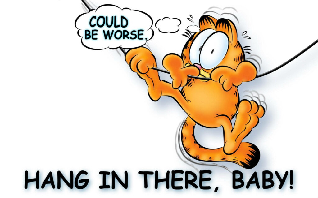 Garfield clinging to wire with determined look and motivational hang in there baby speech bubble wallpaper