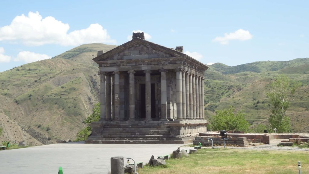 Garni Temple basalt Greco Roman architecture Armenian mountains pale blue sky wallpaper background