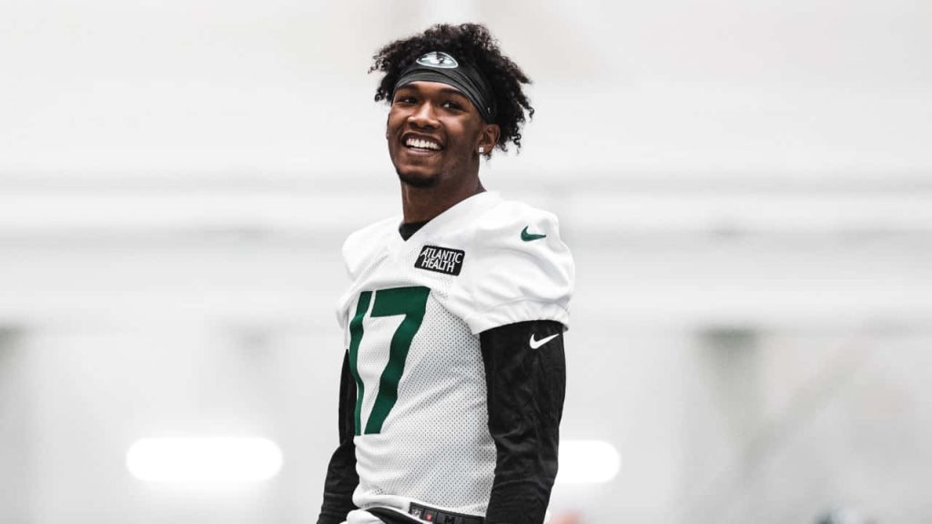 Garrett Wilson New York Jets wide receiver smiling in white jersey black headband NFL wallpaper