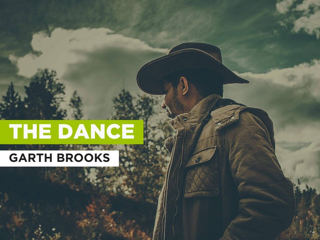 Garth Brooks in cowboy hat profile with cloudy forest background and The Dance text wallpaper