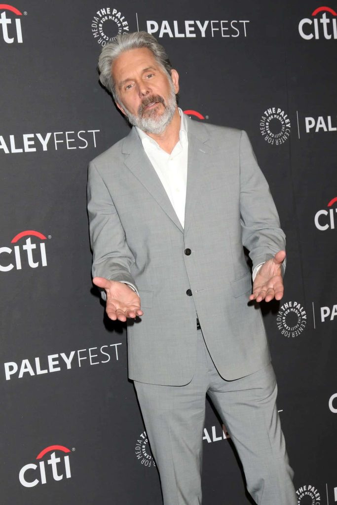 Gary Cole in light gray suit posing at PaleyFest step and repeat professional photo background Wallpaper