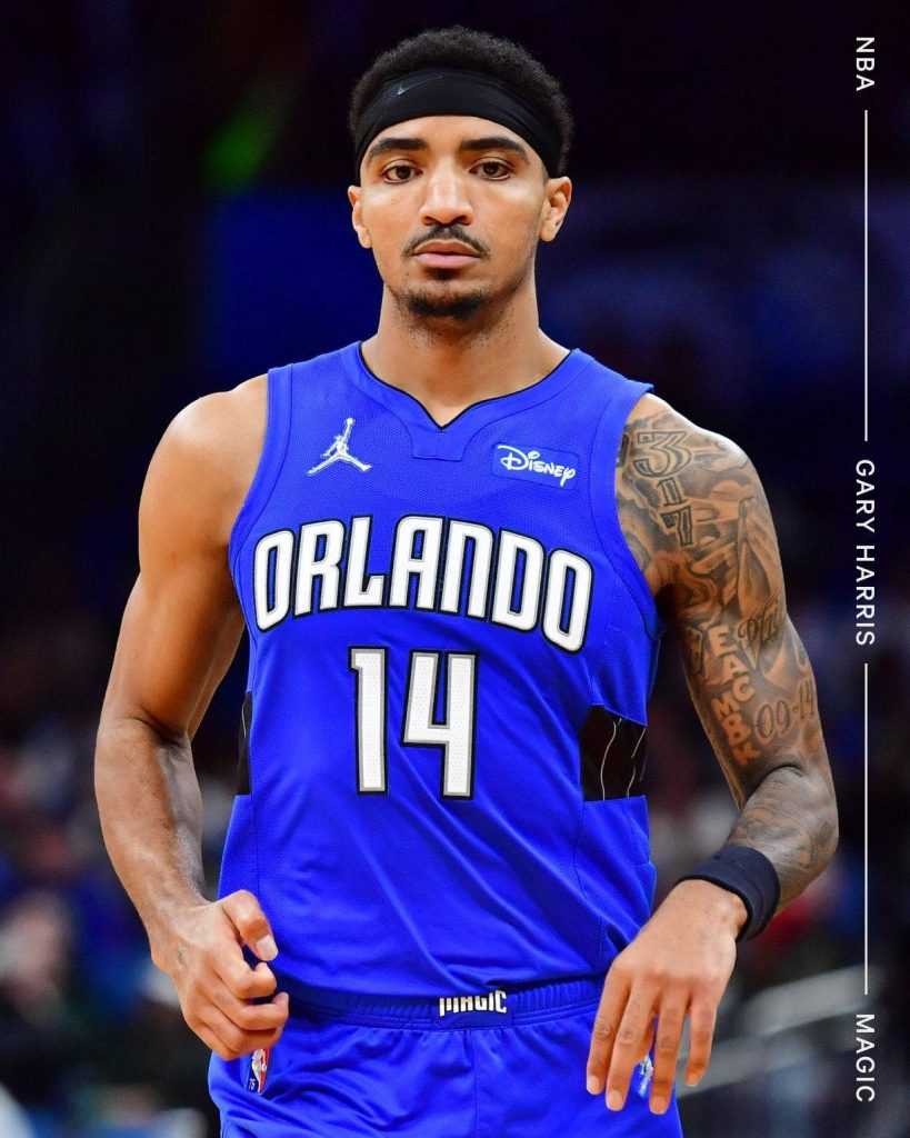 NBA guard Gary Harris in Orlando Magic blue jersey with tattoos and headband sports wallpaper