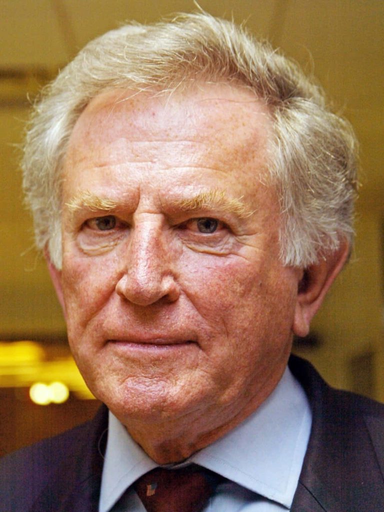 Close-up portrait of former US Senator Gary Hart with sharp details and serious expression wallpaper
