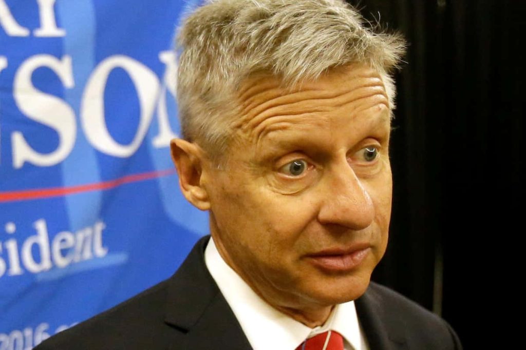 Gary Johnson 2016 campaign portrait in suit and red tie with blue presidential backdrop Wallpaper