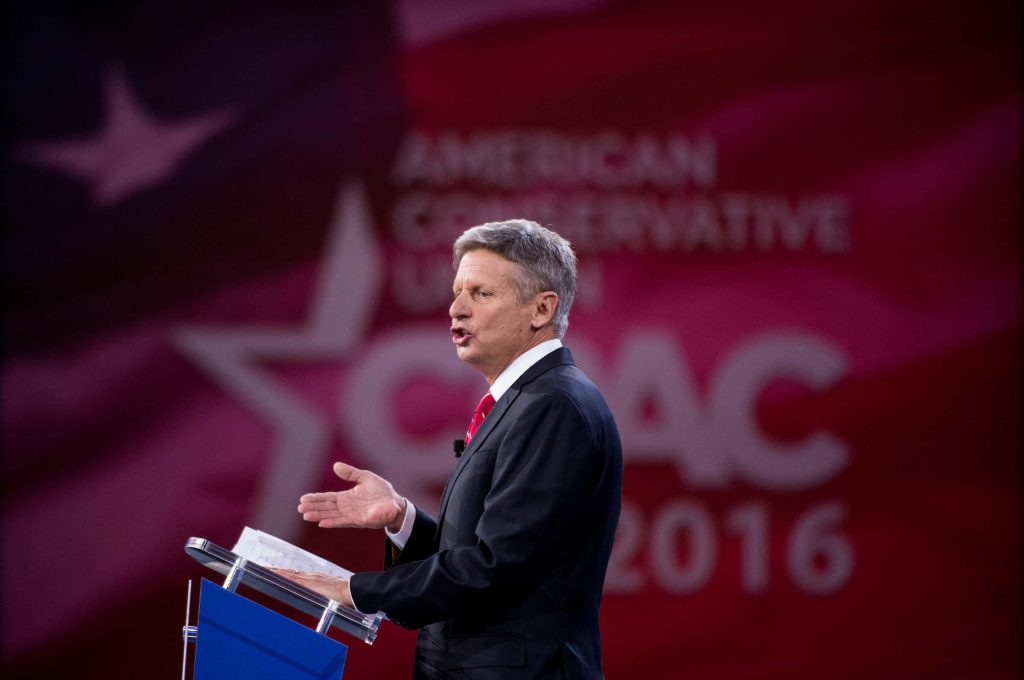 Gary Johnson speaking at CPAC 2016 in sharp suit red tie American Conservative Union backdrop wallpaper