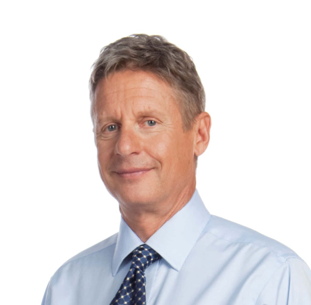 Gary Johnson smiling portrait in light blue shirt and navy tie on white background political wallpaper