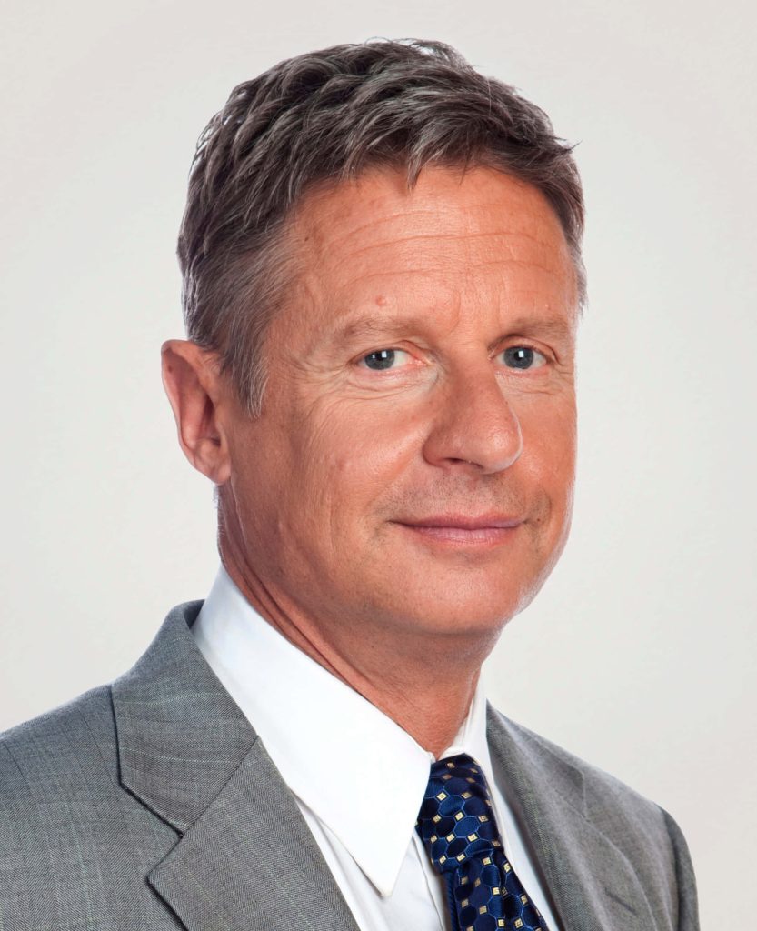 Professional portrait of Gary Johnson in gray suit blue tie neutral background high-quality headshot Wallpaper