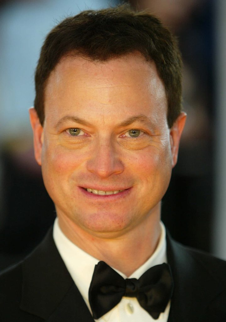 Gary Sinise portrait in black tuxedo bowtie soft lighting elegant formal wallpaper background