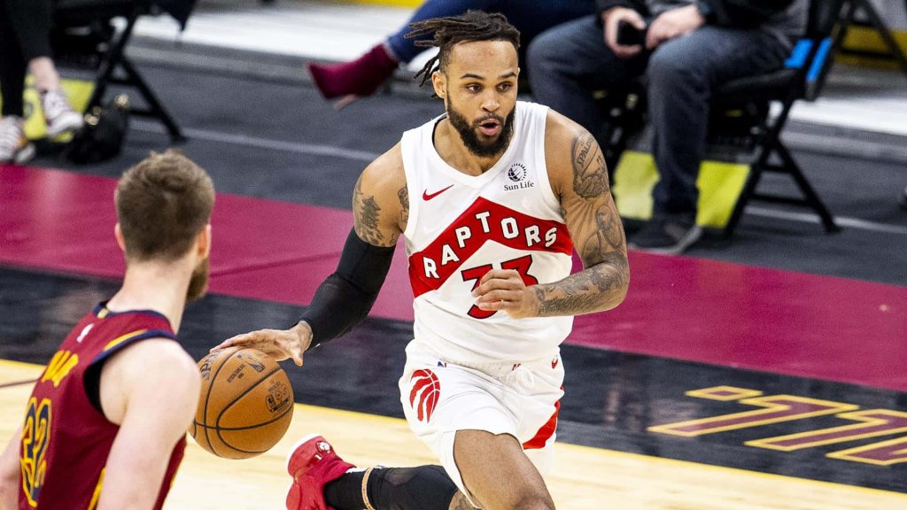 Gary Trent Jr driving past Kevin Love in intense NBA game action basketball wallpaper background