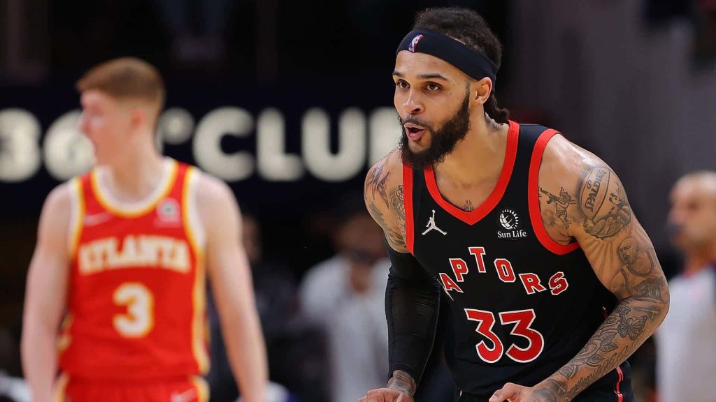 Toronto Raptors Gary Trent Jr in black jersey #33 intense NBA game action wallpaper background