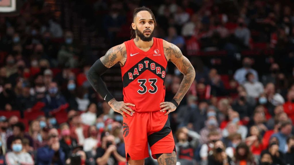 Gary Trent Jr. in Toronto Raptors #33 jersey intense game action blurred arena background Wallpaper