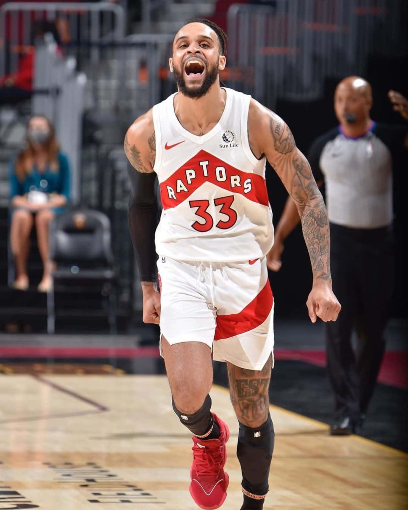 Gary Trent Jr NBA Raptors white jersey celebrating on court against Cleveland Cavaliers wallpaper