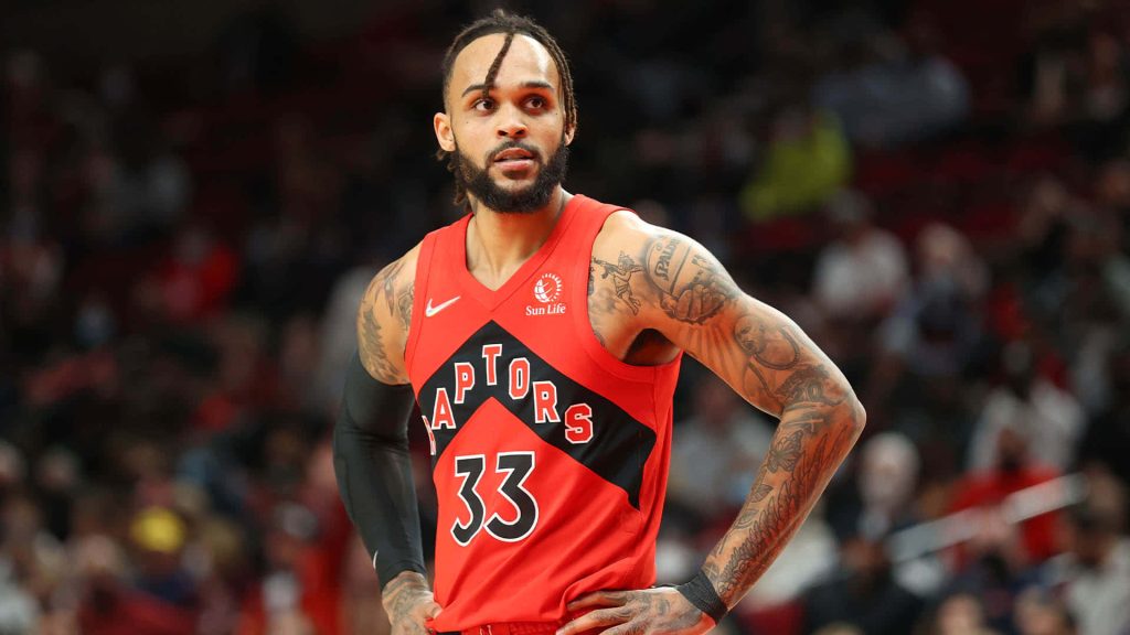 Gary Trent Jr in Toronto Raptors jersey during intense NBA game at Moda Center basketball arena Wallpaper