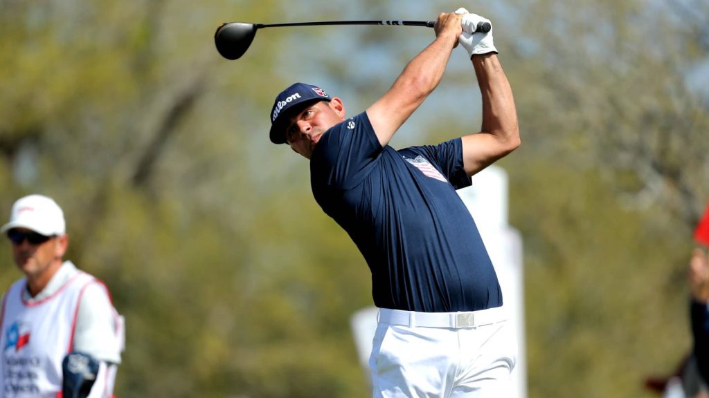 Gary Woodland mid-swing golf action navy polo white pants bright sunny background wallpaper