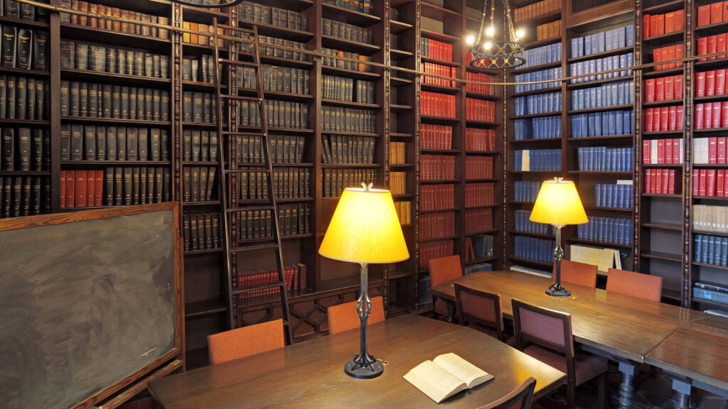 Gates Annex Library Caltech with tall bookshelves wooden study table and classic scholarly ambiance Wallpaper