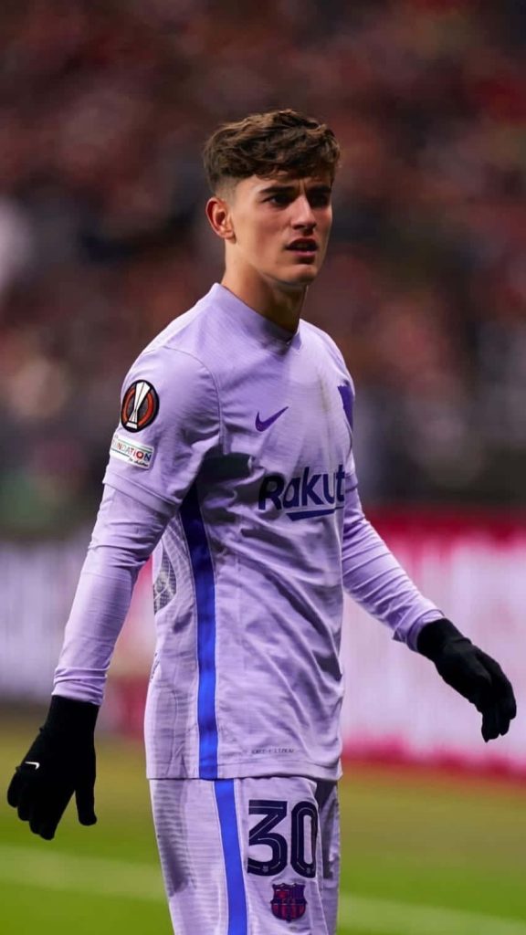 FC Barcelona midfielder Gavi in lavender kit number 30 intense match focus wallpaper background