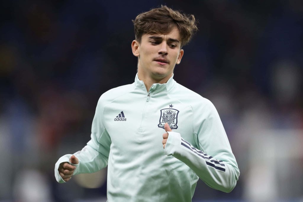 Spanish football star Gavi in mint Adidas Spain top training focused high-resolution wallpaper
