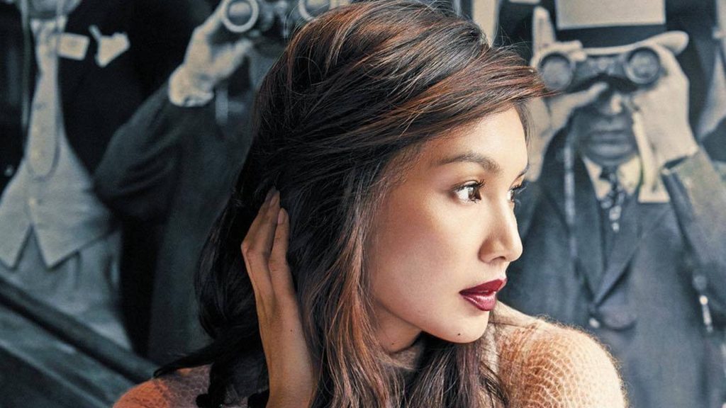 Gemma Chan close-up portrait in brown sweater with bold lipstick and vintage paparazzi background Wallpaper