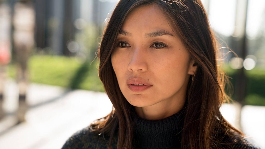 Gemma Chan portrait wallpaper warm golden hour light calm pensive expression dark turtleneck