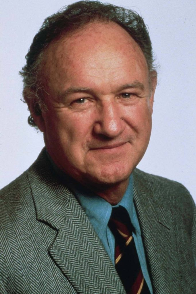 Professional studio portrait of legendary actor Gene Hackman in classic herringbone blazer and tie Wallpaper